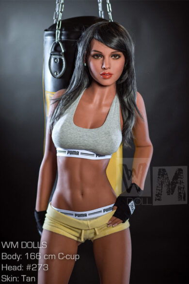 Danielle 166cm MMA Fighter love doll with dark hair in workout gear standing by a punching bag