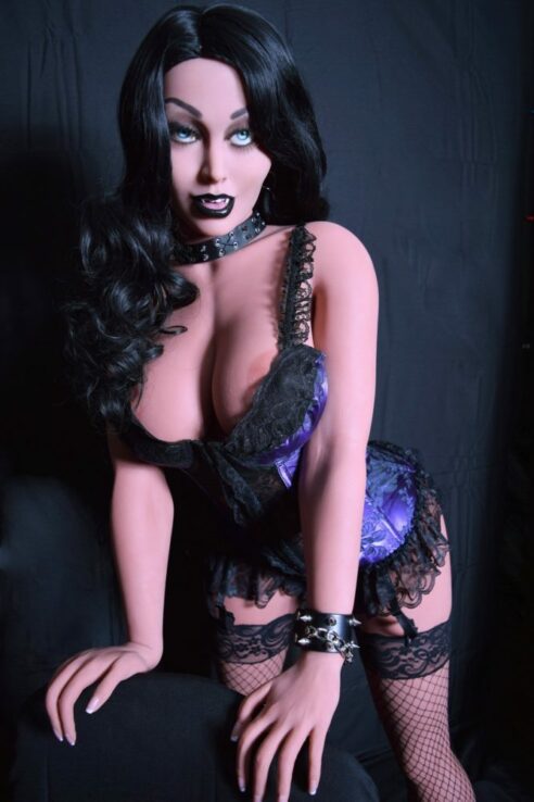 Marissa 165cm theater actress sex doll in gothic style poses in black lingerie with striking black hair against a dark backdrop.