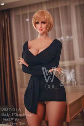 Electra – 173cm dominatrix sex doll wearing a form-fitting black dress, with short blonde hair and a light tan skin tone.