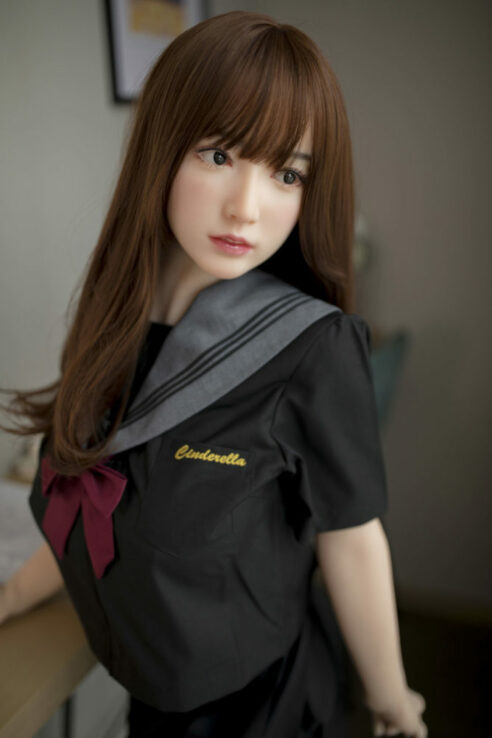 T1 Miyou T159 Anime Fighter sex doll in black sailor-style outfit with long brown hair indoors