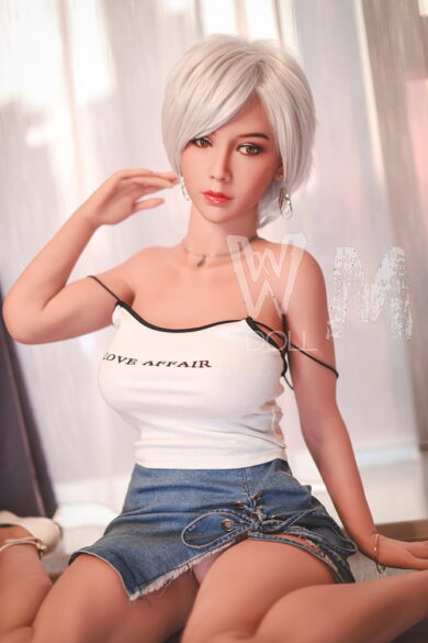 Kylie 170cm D Cup #56 Head WM love doll with short white hair in white top and denim skirt sitting casually indoors