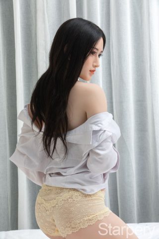 Liao 171cm C-Cup Starperry Sex Doll in a white shirt and yellow lace shorts, posed sideways with long dark hair.