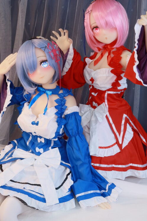 Aiiko love dolls in vibrant blue and red outfits with flowing sleeves and intricate accessories posed indoors capturing anime essence