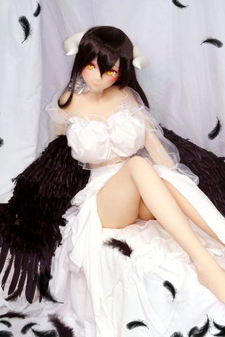 Aotume 155cm F Cup doll with #33 head, wearing a white dress and black feathered wings, sitting on a white background.