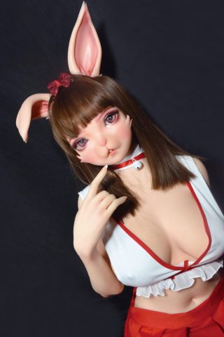 Aida Rina – 150cm bunny silicone sex doll with long brown hair, wearing a white top and red skirt, posing playfully.