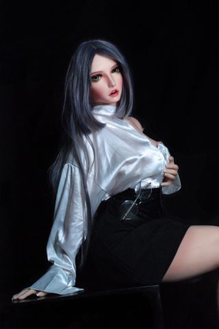 Misa – 150cm Elsa Babe silicone sex doll wearing a white shirt and black skirt, seated with long hair and glasses.