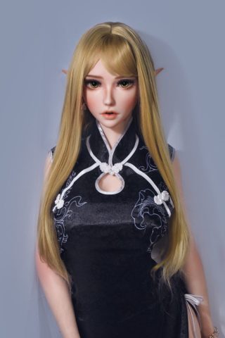 Ria – 165cm Elsa Babe silicone sex doll wearing a black dress with white details and long blonde hair.
