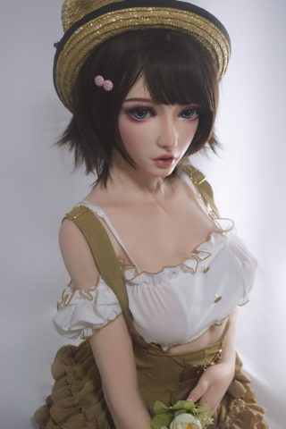 Sawako – 150cm Elsa Babe Silicone Sex Doll wearing a white blouse and brown skirt, holding a flower, with a straw hat.