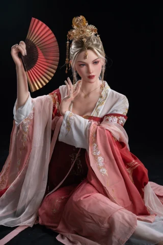 Kaia 170cm C Cup doll wearing a traditional red and pink outfit, holding a fan, with long blonde hair and a serene expression.