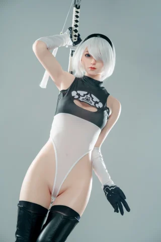 Nier 170cm C Cup doll in a black and white bodysuit, holding a sword, with fair skin and gloves.