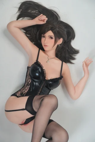 Tifa 168cm D Cup Fair Skin in a black corset and stockings, posed on a light background.