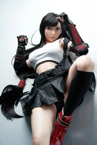 Tifa Lockhart Sex Doll 167cm in a black skirt and white crop top, posed with long hair and red boots.