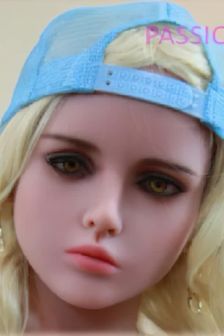 Passion Doll with blonde hair wearing a light blue cap, featuring realistic facial details and earrings.