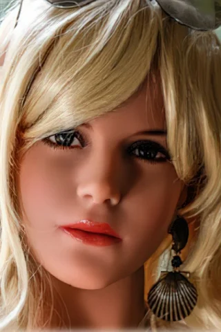 Doll 118 features long blonde hair with a flower accessory, wearing large earrings and has glossy lips.