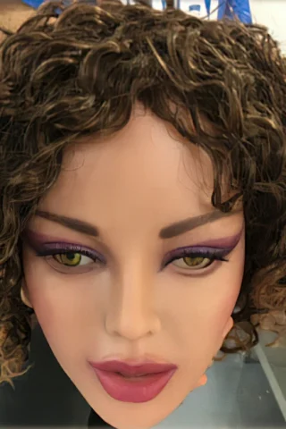 121cm mannequin head with curly brown hair, green eyes, and bold purple eye makeup.