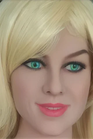 Doll with blonde hair and green eyes, featuring a soft smile and natural makeup.