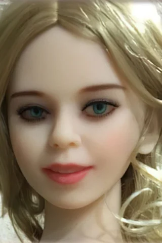 134cm doll with blonde wavy hair, blue eyes, and a subtle smile against a textured background.