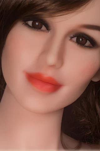 Doll 147 features a smiling face with brown eyes and long brown hair, showcasing soft makeup and natural skin tones.
