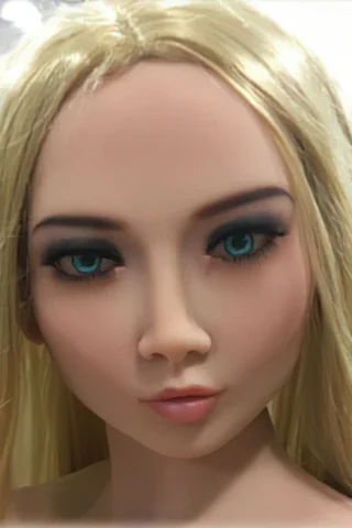 158cm doll with long blonde hair and striking blue eyes, featuring detailed makeup and a neutral expression.