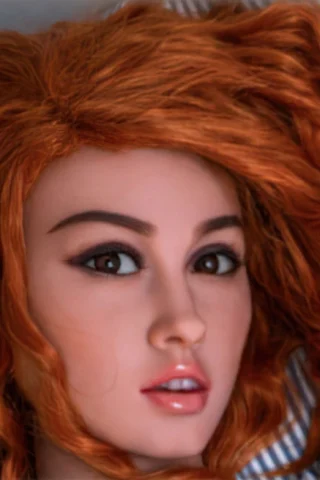 162cm doll with long, wavy red hair and striking brown eyes, resting on a light-colored surface.