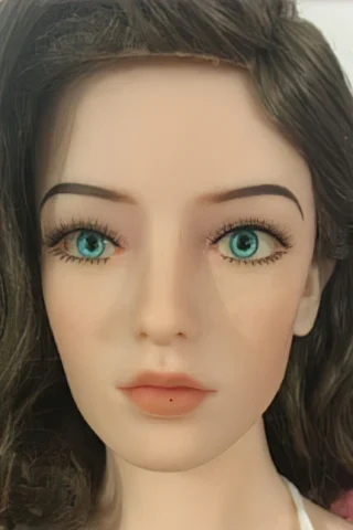 167cm doll with wavy brown hair and blue eyes, featuring natural makeup and a neutral expression.