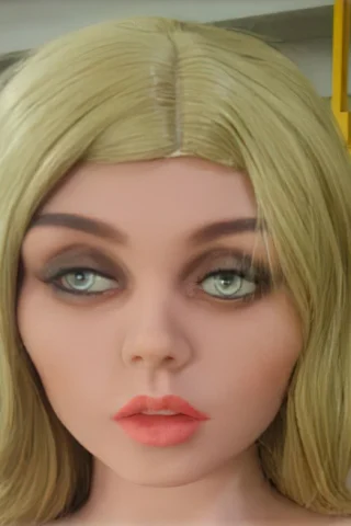 172cm doll with long blonde hair and green eyes, featuring a neutral expression and subtle makeup.