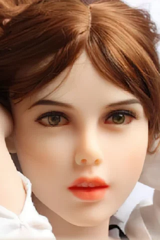 185cm doll with brown hair and green eyes, wearing a white shirt, resting with hands behind her head.