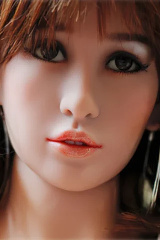 Doll, 160cm, with long brown hair, wearing large silver hoop earrings and a subtle makeup look.
