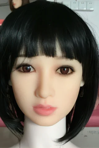 Doll 192 features a short black bob hairstyle and brown eyes, with a neutral expression against a backdrop of other dolls.
