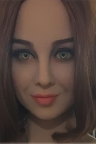 194cm doll with short brown hair and green eyes, featuring a soft smile and natural makeup.