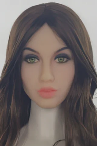 Doll head with long brown hair and green eyes, featuring subtle makeup and a neutral expression.