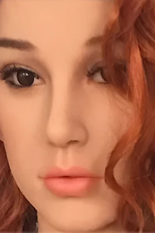 215cm doll with wavy red hair and natural makeup, featuring detailed facial features and soft lips.