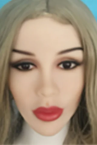 Doll with long blonde hair and red lips, featuring detailed facial features and a neutral background.