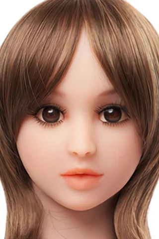 Doll 222 features a smooth face with brown hair, large brown eyes, and soft pink lips.