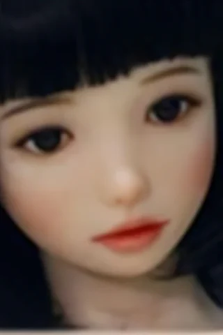 Doll 224 features a young girl with short black hair and delicate facial features, wearing a dark patterned background.