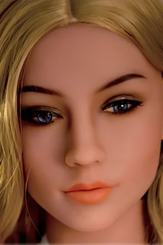 227 doll with long blonde hair and blue eyes, featuring a neutral expression and soft makeup.