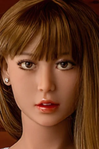 230cm doll with long brown hair and a neutral expression, wearing a white top against a wooden background.