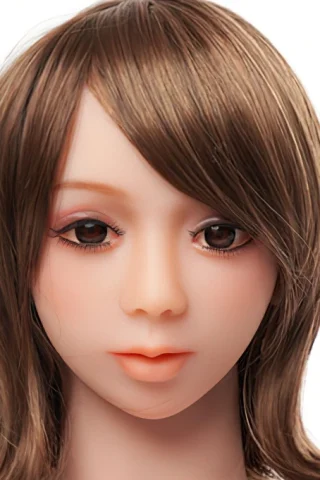 Doll head with brown hair and realistic facial features, including brown eyes and subtle makeup.