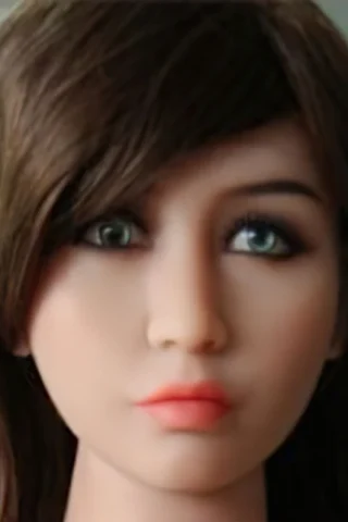 235cm doll with long brown hair and green eyes, featuring a neutral expression and smooth skin.