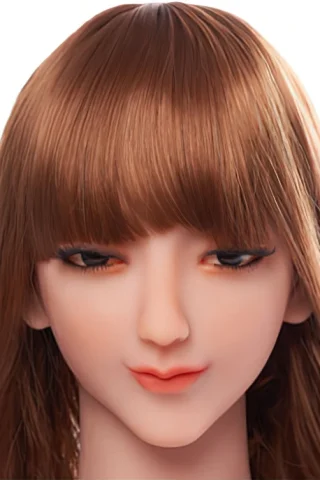 246 doll with long brown hair and natural makeup, featuring soft facial features and closed eyes.