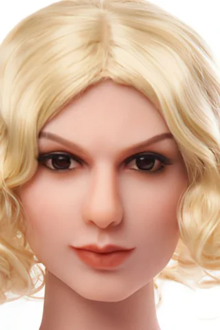 Blonde doll head with short, wavy hair and a neutral expression, featuring detailed facial features and dark eyes.