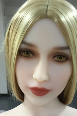 Doll with blonde hair and yellow eyes, featuring a neutral expression and smooth skin texture.