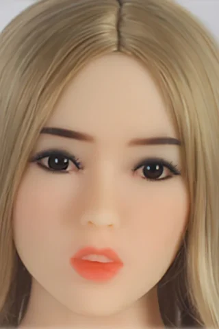 289 doll with long blonde hair and realistic facial features, wearing a neutral expression and soft pink lips.