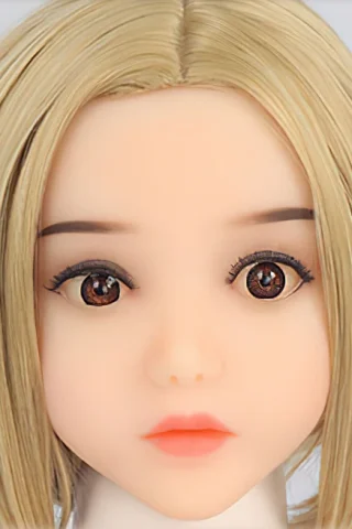 Doll head with short blonde hair and brown eyes, featuring a neutral expression and smooth skin.