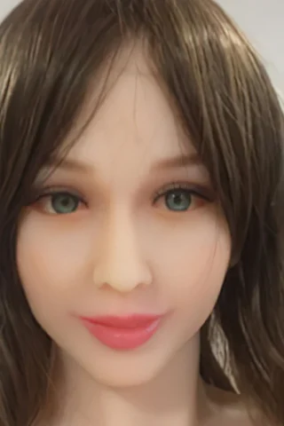 Doll with long brown hair and green eyes, featuring a soft expression and natural-looking lips.
