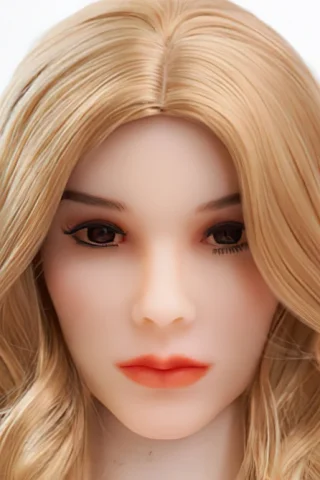 Doll head with long blonde wavy hair, light skin, and natural makeup, featuring brown eyes and full lips.