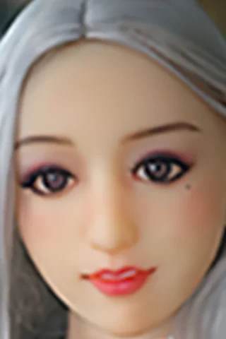 Doll with long silver hair and light makeup, featuring large eyes and a subtle smile.