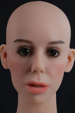 Bald doll head with realistic facial features, including dark eyes and subtle makeup against a black background.