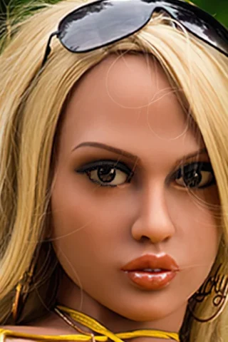 336cm doll with long blonde hair, wearing sunglasses and yellow clothing, set against a green background.