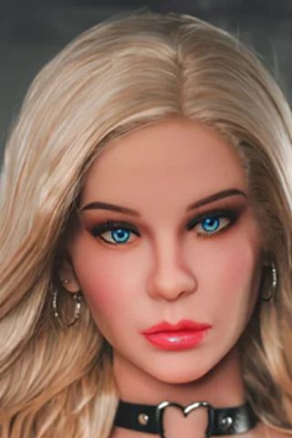 Blonde doll with blue eyes and long hair, wearing a black choker and earrings.